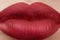 Sweet kiss. Close-up of woman\'s lips with fashion red make-up. Beautiful female mouth, full lips with perfect makeup