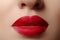 Sweet kiss. Close-up of woman\'s lips with fashion red make-up. Beautiful female mouth, full lips with perfect makeup