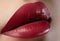 Sweet kiss. Close-up of woman\'s lips with fashion red make-up. Beautiful female mouth, full lips with perfect makeup