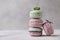 Sweet lavander, mint and pistachio macaroons on light background