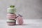 Sweet lavander, mint and pistachio macaroons on light background