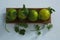 Sweet limes and coriander in tray