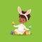 Sweet little african american girl with bunny ears and rabbit costume playing with painted eggs, kid having fun on