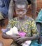 Sweet little African girl overjoyed with first soft toy