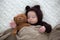Sweet little baby boy, dressed in handmade knitted brown soft te