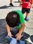 Sweet little boy playing with Pigeon near Batu Caves temple in Malaysia, Baby boy playing with pigeons