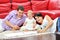 Sweet little girl with her parents drawing and having fun