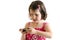 Sweet little girl in pink dress play on smartphone concetrated i