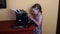 Sweet little girl writes on vintage typewriter. Preschool concept, childhood concept. Cute girl like preschooler