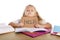 Sweet little school girl holding help sign in stress with books and homework