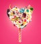 Sweet Lolipop in Heart form of whipped cream with sweets, jellies, heart front view. Crazy freakshake food trend. Front