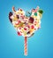 Sweet Lolipop in Heart form of whipped cream with sweets, jellies, heart front view. Crazy freakshake food trend. Front