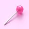 Sweet lollipop on stick on pink pastel background