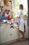 A Sweet Medley: Sharing Muffins and Watermelon Bliss between Sisters in the Kitchen