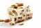 Sweet nougat with almonds and pistachios on white background.Macro.AI Generative