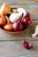 Sweet onions of different varieties and dried husk in a bowl