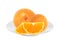 Sweet oranges on white plate isolated