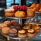 Sweet pastries with berries. Showcase in a candy store. Glass stand with cake eclairs and tartlets.