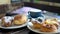 Sweet pastries in cafe. Puff pastry, fresh buns with powdered sugar and berries