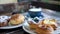 Sweet pastries in cafe. Puff pastry, fresh buns with powdered sugar and berries