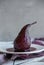 Sweet pear cooked with red wine, delicious dessert