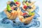 Sweet phyllo cups with fresh berries and whipped cream