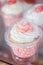 Sweet pink vanilla cupcakes in plastic package for take away