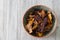 Sweet potato, beetroot and parsnip crisps chips in a patterned bowl.