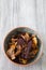 Sweet potato, beetroot and parsnip crisps chips in a patterned bowl.