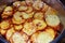 Sweet potato food dish, potato fritters being cooked in a vending stall