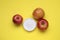 Sweet powdered fructose and apples on yellow background, flat lay