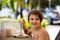 Sweet preschool boy, eating desert in a restaurant on beach summer resort