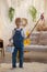 Sweet preschool boy in studio, playing with, egg for Easter and eating chocolate, child on Easter holiday