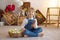 Sweet preschool boy in studio, playing with, egg for Easter and eating chocolate, child on Easter holiday