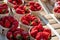 Sweet ripe french red strawberries in wooden boxes on Provencal farmers market, Cassis, France