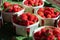 Sweet ripe french red strawberries in wooden boxes on Provencal farmers market, Cassis, France