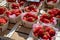 Sweet ripe french red strawberries in wooden boxes on Provencal farmers market, Cassis, France