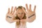 Sweet and scared little schoolgirl showing the text stop bullying written in her hands