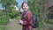 A sweet school-age girl goes to school with a school bag.