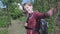 A sweet school-age girl goes to school with a school bag.