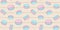 Sweet seamless pattern with pink and blue macaroons on a beige background with stripes and polka dots