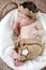 Sweet sleeping newborn baby in wicker basket-collage