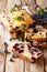 Sweet sliced blueberry bread muffin with mint closeup. vertical