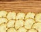 Sweet slices of pineapple fruit on wooden background