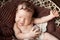 Sweet smiling newborn baby girl. Newborn girl 3 weeks old lying