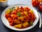 sweet and sour chicken with colorful bell pepper on a plate