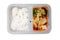 Sweet and sour chicken and rice ready meal in a plastic container. Top view.