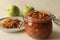 Sweet and spicy Pickled Green apple or achar made with finely sliced green apple preserved in brine, vinegar, edible oil along