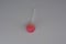 Sweet strawberry, very tasty, round sucking candy on a white plastic stick of white and pink color on a white background, chupik,