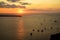 Sweet sunset scenic ocean view in vast Aegean sea with sailing ships silhouette, abstract cloud and light reflection